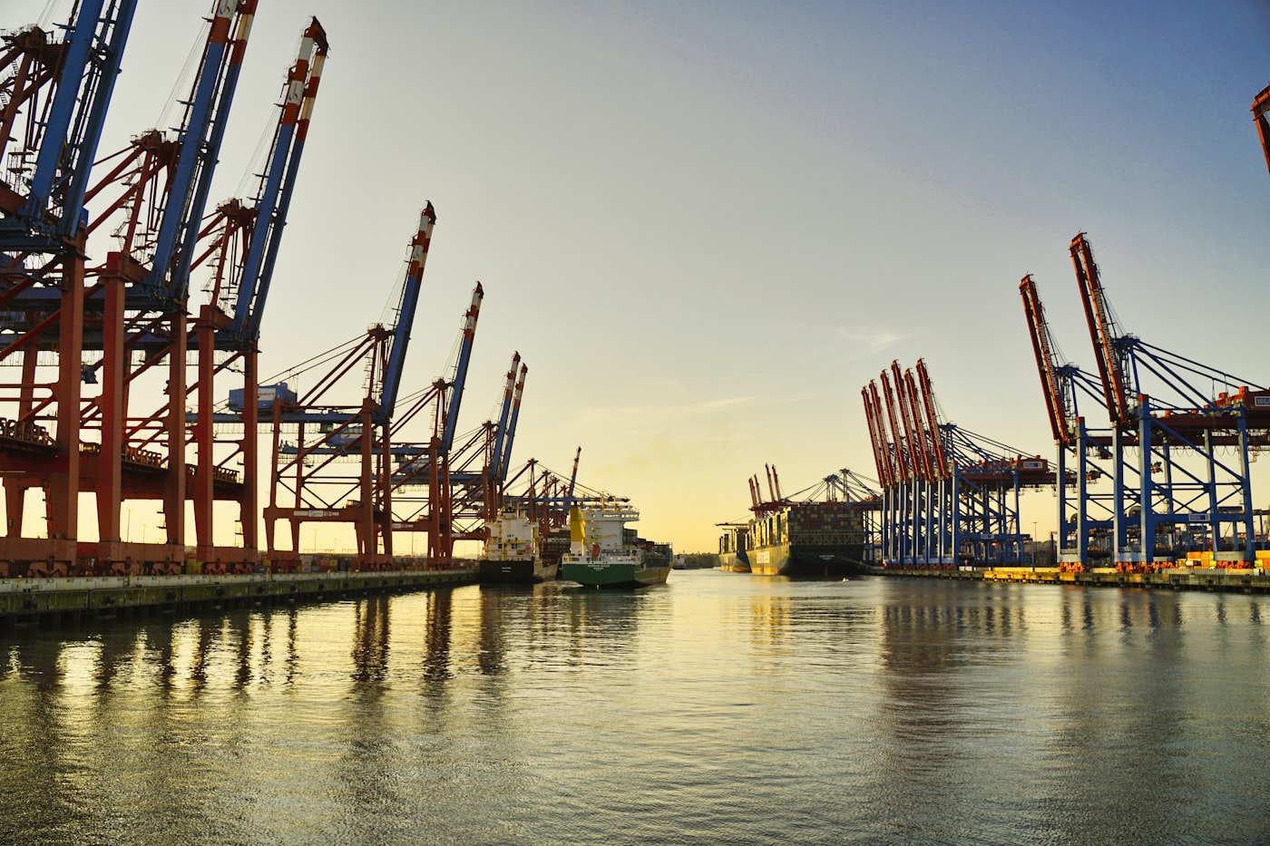 Container cranes at a port terminal at sunrise