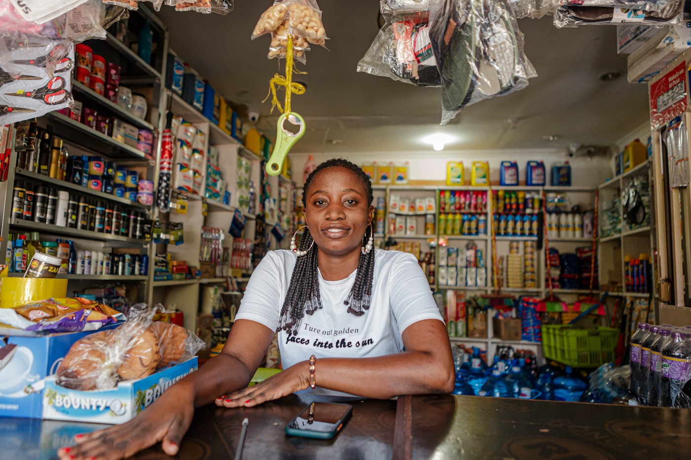Business owner behind the counter of her shop